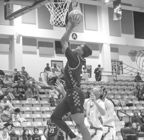 VERTICAL - Levelland Lobo Sean Landrum made the athletic lay-up during the teams away game against the Andrew Mustangs this past Tuesday night. (Staff photo by Aalijah Soliz)