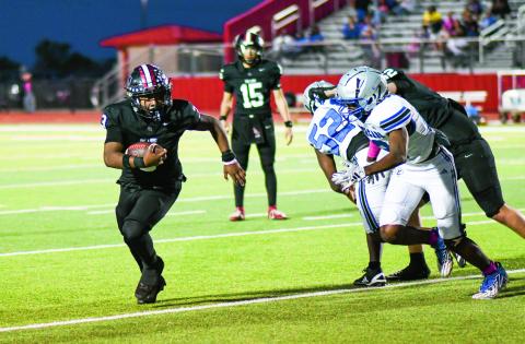 MARTIN ON THE RUSH - Sophomore running back Noah Martin rushes the ball for Levelland during a game against Estacado this past Friday night at Lobo Stadium. Martin would finish with seven carries for 45 yards and a touchdown in the Lobos 20-13 loss. (Staff photo by Jentezen Smith)