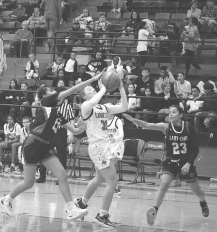 HARD SHOT - Levelland Loboette Presly Smith made the tough layup during the teams win against Brownfield last Tuesday night. The Loboettes traveled to Hereford to take on the Whitefaces this past Friday night. (Staff photo by Aalijah Soliz)