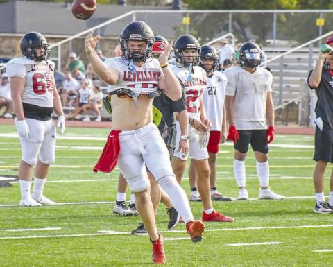 THROW ON THE RUN - Levelland quarterback Rusty Johnson threw the ball to his recievers during Levelland’s scrimmage against Idalou this past Friday night. (Staff photo by Dom Puente)