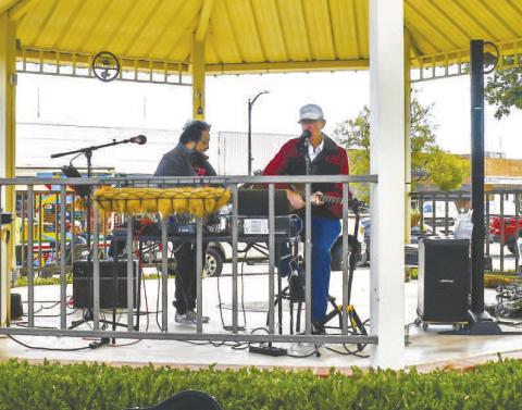 LIVE MUSIC DURING LUNCH - For the last Food Truck Thursday live music was provided courtesy of Juan Partida and Nick Williams. The duo played some of their favorite songs Thursday under the gazebo in downtown Levelland. (Staff photo by Essence Childers)