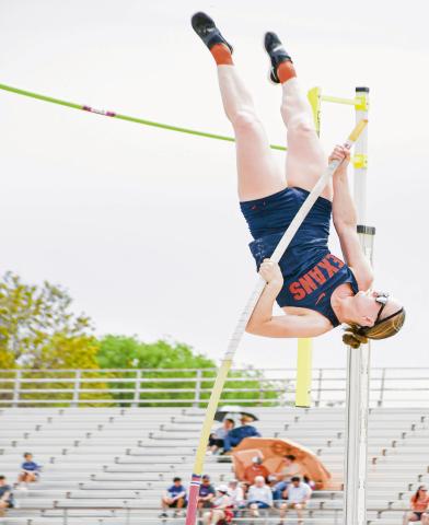 GOIN’ UPSIDE DOWN - SPC’s Olga Lapuzova goes upside down to clear the bar during the pole vault this past Friday at the SPC Alumni Elite Invitational at the SPC track complex. (Staff photo by Jentezen Smith)