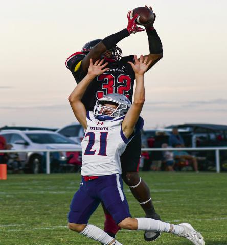 GET MOSSED - Senior Nate Sansom mosses a defender on a contested catch that he would take for a Whitharral Panthers touchdown during their Homecoming game against the Valley Patriots last Friday night. Sansom would score four touchdowns on the night and the Panthers would go on to win 68-48. (Staff photo by Jentezen Smith)