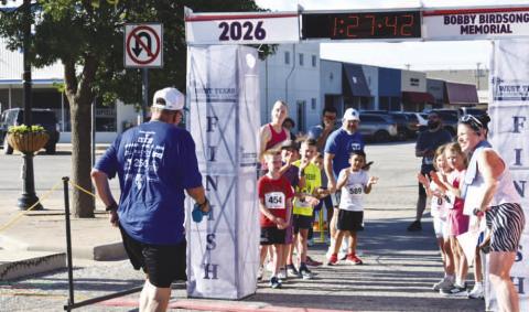 - Participant in the Bobby Birdsong Memorial Mosaic Run 2 Mile brings the race to a close. (Staff photo)