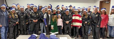 BLUE SANTA - The Blue and You non-profit organization held their annual Blue Santa event on Dec. 14. Pictured are Blue and You volunteers along with local law enforcement. The winter-time activity allows for sponsored local children to be picked up by the Levelland Police Department (LPD) for breakfast and a visit to Walmart for shopping. (Staff photo by Essence Childers)