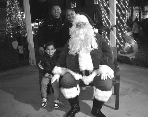 NAUGHTY OR NICE - Santa was at the Gazebo on Hockley County Courthouse lawnThursday evening. Many children participated in seeing Santa and telling him what they want for Christmas. Pictured is the Lopez family who waited their turn to see Santa. (Staff photo by Emily Campos)