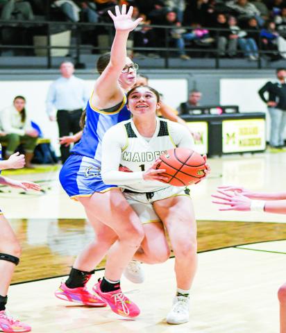 PAINT BATTLE - Morton’s Ada Torres and Whiteface’s Keyarah Castaneda battle in the paint during their district basketball game this past Tuesday at Morton High School. (Staff photo by Jentezen Smith)