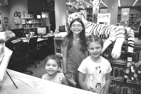 LIBRARYTIME- Pictured are Yazi Mendez, Alexander Mendez and Payton Elmore who participated in the Hockley County Library Summer Program on Wednesday. (Staff photo by Emily Campos)