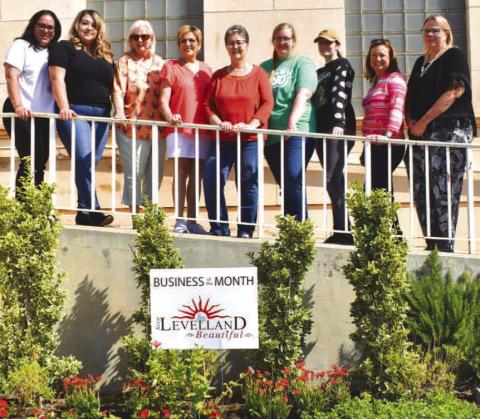 BUSINESS OF THE MONTH - August Business of the month was awarded to the Hockley County Library by Keep Levelland Beautiful. Pictured from left to right are: Janie Morales, Stephanie Rodriguez, Donna Wheeler, Barbra Pinner, Amy Cantwell, Sabre Reynolds and Shawna Carpenter Lopez. The Mosaic Coffee Company friends are part of a non-profit organization that planted the beautiful plants and flowers at the Hockley County Library. (Staff photo by Emily Campos)