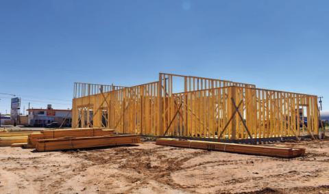 - Construction crews are continuing to work on the lot located at the corner of Highway 114 and Highway 385. Foundational work has been completed for workers to begin framing the new building. (Staff photo by Emily Campos)
