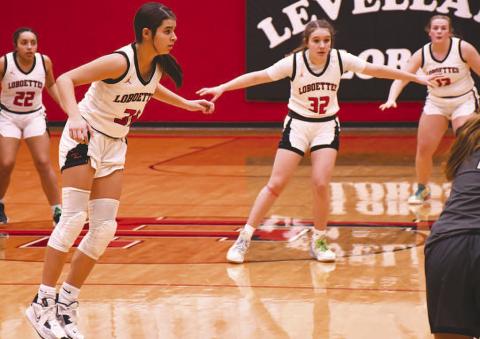 ON A STRING- The Lobboettes have hung their hats on defense this season and continued to be suffocating defensively against Big Spring in district action Tuesday. The Lady Steers were held scoreless in the first quarter and had three points going into halftime. Pictured on defense are Olivia Velardez, Leilani Sanchez, Emery Smith and Laci White. (Photo Courtesy of Edward Ramirez)