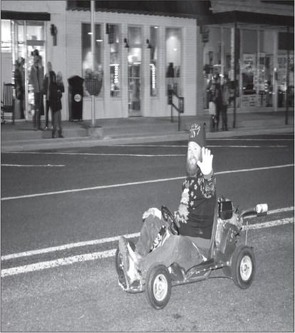 GO CART FUN- This past Thursday, Levelland Main Street, SPC &amp; the Marigolds hosted Festival of Lights Christmas on the Square. The event started with the lighting of the SPC campus and the festivites moved to the Square. There were over 20 entries that participated in the parade. In photo was one of the parade participants. It was a night full of fun with many activities for the everyone that attended .(Staff photo by Emily Campos)