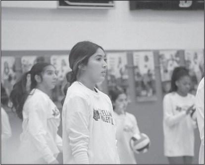 PRE-GAME - Levelland Loboette Gabby Pesqueda was warming up with her teammates before the game. The Loboettes won the game 3-1 thank to their team effort. (Staff photo by Aalijah Soliz)