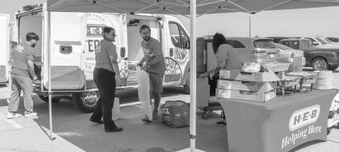 LUNCH PROVIDED - H-E-B Provided BBQ sandwiches at the South Plains Food Bank distribution event on Wednesday at the Lobo Stadium. (Staff photo provided by Emily Campos)