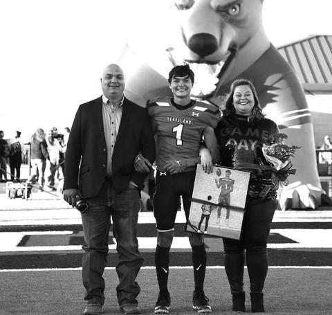 SENIORLOBO- Levelland seniors were recognized last Friday during the Lobos home win game against Borger. Lobo Zameron Lecroy was escorted by his parents Anthony and Angelica Lecroy. (Staff Photo by Dom Puente)