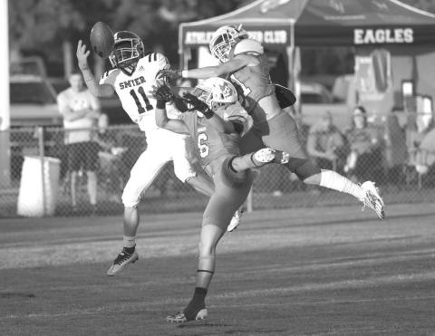 GREAT CATCH - Smyer wide receiver made the great catch in double coverage during the teams district opener against the Ropes Eagles. (Photo courtesy of Donovan Martin)