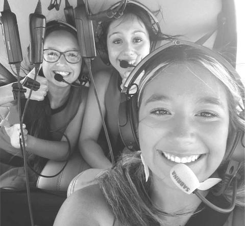 GAME BALL- Levelland High School Cheer Coach Northcutt and LHS Cheer leaders arranged for the game ball to be delivered by helicopter this past Friday. Shown in no particular order Kameala Baeza, Taylyn Ledesma and Alex Pena riding in helicopter with Derek Dunn (not pictured) to make that game ball delivery to the Levelland football stadium.(Photo submitted by Cristal Isaacks)