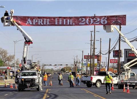 Crews from the City of Levelland Public Works, TxDOT and Xcel Energy installed the Centennial banner on College Ave. near the intersection of Hwy 114 and Hwy 385 to alert people to the upcoming celebration on April 11. (Staff photo)