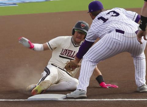 MAXIMUM EFFORT - Levelland Lobo Rance Massey slid into third base during the team’s first game of the Greenwood Tournament this past Thursday morning. (Staff photo by Aalijah Soliz)