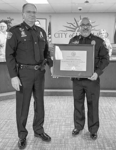 HARD WORK RECOGNIZED - The Levelland Police Department received their Texas Police Chief’s Association Law Enforcement Accreditation Program Certificate during Monday’s Levelland City Council meeting. Pictured are Amarillo Police Chief and Region Two TPCA Director Martin Birkenfield and Levelland Police Chief Albert Garcia holding the TPCA Certification. (Staff photo by Dom Puente)