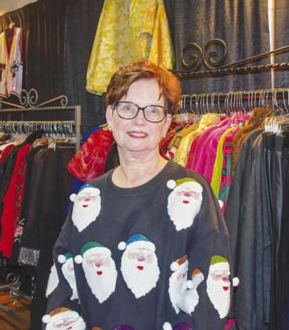 YOUR SHOP – Carolyn smiled at the Your Shop vendor stand, selling clothes to attendees of the Fa La La event at Levelland’s Mallet Event Center &amp; Arena Dec. 12. (Staff photo by Evin Thomas)