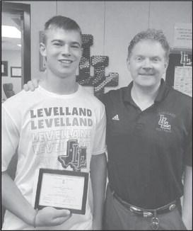 SCHOLARSHIP PROGRAM - Levelland ISD High School Principal Mathew Birdwell announced LHS senior Austin Ellis has been named Commended Student in the 2024 National Merit Scholarship Corporation. Pictured is Mr. Birdwell presenting Ellis with the award.(Photo submitted by Cristal Isaacks)