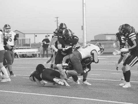 TRUCK - Smyer wide receiver had a good run against the Leapord defense trucking over one player to get some much needed yards. (Staff photo by Aalijah Soliz)