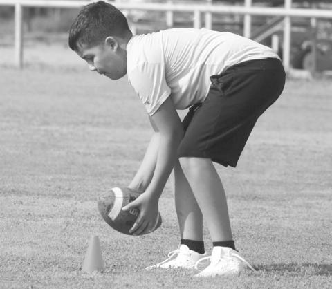 ATHLETIC CATCH - A Morton student made the tough catch at his feet last Thursday morning at the Morton Football Camp. The camp lasted from Thursday to Friday in the morning to keep the kids active during the summer. (Staff photo by Aalijah Soliz)