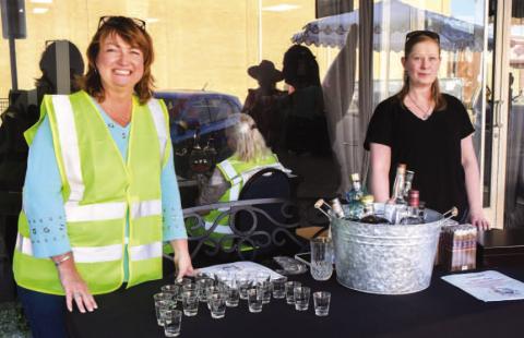 Tammy Franklin and Maryan Moore were set up outside of Studebakers VIP lounge in downtown Levelland during Friday night’s Sip and Swirl event. (Staff photo by Evin Thomas)