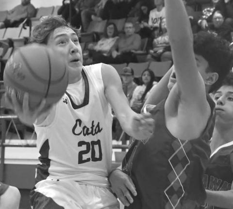 Micah Zapata had 11 points for the Smyer Bobcats in a 51-41 loss to the visiting Sundown Roughnecks in UIL high school boys’ basketball action last Friday. The Bobcats will be in the Caprock Classic Basketball Tournament December 28-30. (Photo by Jay Kelley)