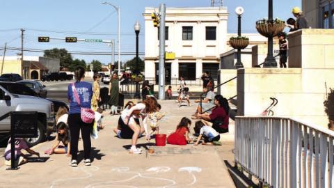 CHALK DAY – Youth participate in the Hockley County Library Chalk Day this past Wednesday. Attendees had fun drawing and playing games with chalk. (Staff photo by Ada Niederhauser)