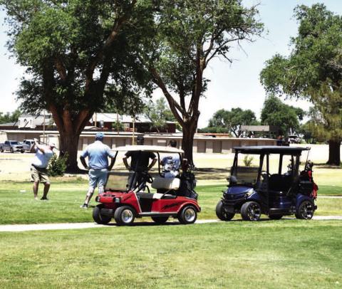 ENJOYING THE WEATHER-- Golfers enjoyed the warm weather during the Levelland Chamber of Commerce annual golf tournament held this past Monday. The tournament was held at the Levelland County Club. (Staff photo) (See “Chamber Golf Tournament Results” continued on page 10)