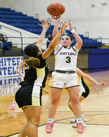 MIDDY MAGICIAN - Whiteface Lady Lope Kambry Sanders pulls up for a mid-range jump shot during their home game against Morton this past Tuesday night. Sanders led the Lady Lopes with 25 points. (Staff photo by Jentezen Smith)