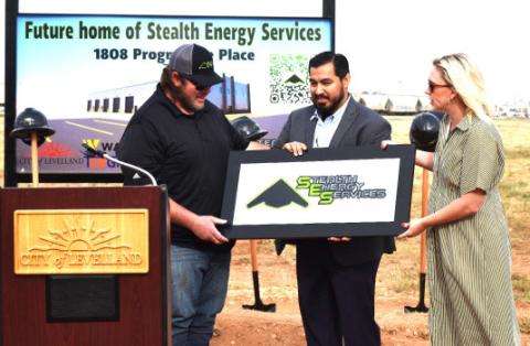 Stealth Energy co-owner, president and CEO Jeramiah Maynard was presented with a special plaque by assistant city manager Justin Balderas and Mayor Breann Buxkemper at the company’s groundbreaking ceremonies on Friday. (staff photo)