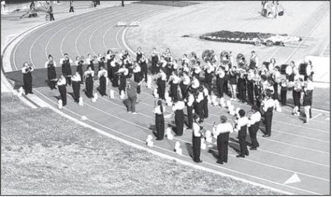 The Levelland Lobo Band warms up before competing at the UIL Region 16 Marching Band competition at Lowrey Field in Lubbock on Saturday. The band earned a Superior rating and will advance to the Area competition on Oct. 25.