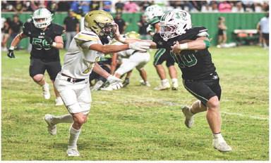 STIFF ARM - Senior running back Ryland Keith stiff arms a Sudan defender while rushing the football during Ropes’ homecoming football game this past Friday night at Ropes Eagle Stadium. The Eagles would win 55-13, (Staff photo by Jentezen Smith)