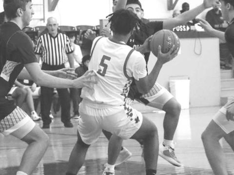 UNDER PRESSURE - Levelland Lobo Sean Landrum broke the full press on the Hale Center defense during the teams contest in the Littlefield Tournament last week. (Staff photo by Aalijah Soliz)