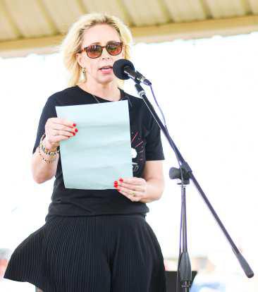 Mayor Breann Buxkemper read the Mayoral Proclamation at the Centennial celebration for the city of Levelland held on Sunday. The decision was made to move the event due to weather concerns. (Staff photo by Jentezen Smith)