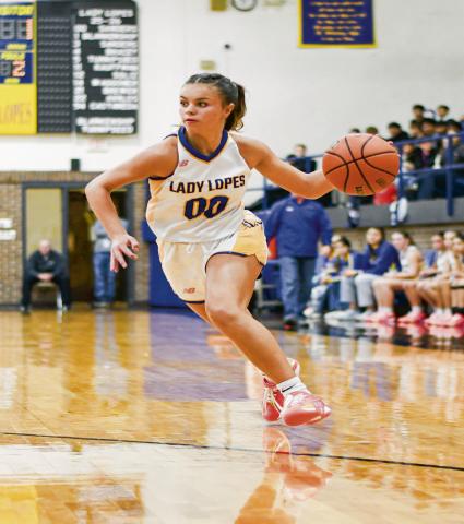 SANDERS ON THE DRIVE - Whiteface junior point guard Lainey Sanders drives the basketball during a game in the Way Out West Tournament last weekend. Sanders had eight points against West Texas. (Staff photo by Jentezen Smith)