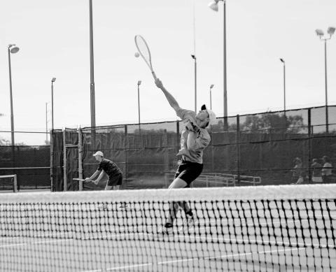 OVERHEAD SMASH – Nathan Ellis performs an overhead smash during a tennis match against All Saints on August 12 at the Burgess-Rushing Tennis Center in Lubbock. (Staff photo by Jentezen Smith)