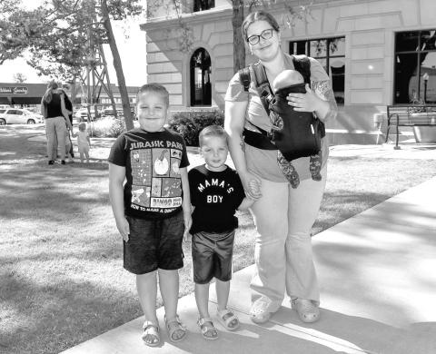 FAMILY FUN- The Hockley County City Library Summer Program continues to have summer activities for children participating in the program. On Wednesday, the program had a Treasure Chest Hunt on the lawn of the Levelland Court House where the children had to go to a different tree to pick up a clue that let them know where the treasure was located. Pictured is Sarah O’Hearon with her children Declan, Driscoll and Wyatt. (Staff photo by Emily Campos)