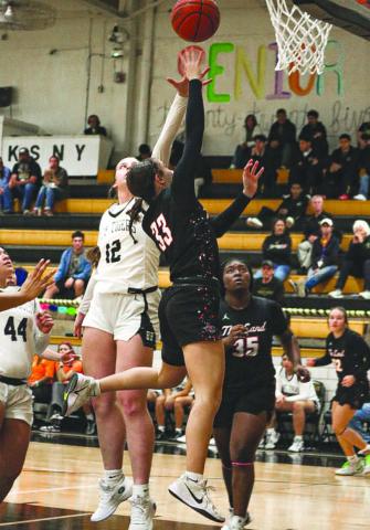 TOUGH FINISHING - Levelland Loboette Presley Smith layed the ball up over the Lady Tiger defense during the team’s district game on the road. (Staff photo by Aalijah Soliz)