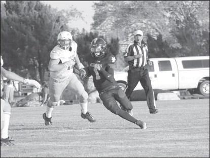 GOOD RUNNING - Morton quarterback Dante Chavez ran the ball last Friday during the teams loss. The Indians will face off against Guymond, OK this Sat. at 1 p.m. in Bushland. (Staff photo by Aalijah Soliz)