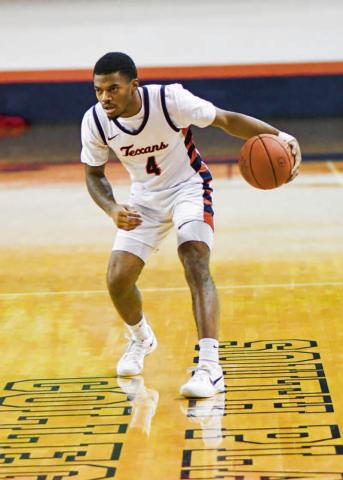 RICHARD RUNS POINT - South Plains College Texans point guard Keith Richard runs point as his team sets up a play during a game earlier this month in the Texan Dome. (Staff photo by Jentezen Smith) (
