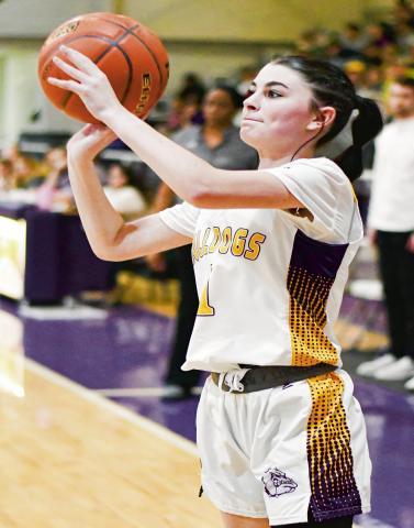 PEEK FOR THREE - Anton Lady Dawg Liberty Peek shoots a three-pointer during their against Wellman Union this past Friday night at Anton High School. (Staff photo by Jentezen Smith)