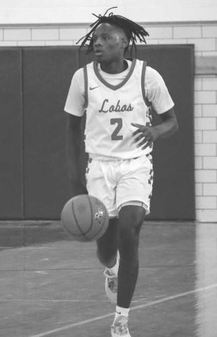 PLAYMAKER - Levelland Lobo Elijah Jordan brought the ball down the court during the teams first game of the Littlefield Tournament last week against the Hale Center Owls. (Staff photo by Aalijah Soliz)