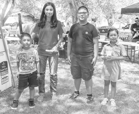 SNOW CONE LINE- The St. Anna’s Catholic Church in Morton held a Jamaica on Sunday . Pictured is Eden Rios, Jhade Rivera, Jared Rios and Hannah Rivera who attended the Jamaica They were patiently waiting in line to get a shaved ice and cool down . ( Photo courtesy of Emily Campos)