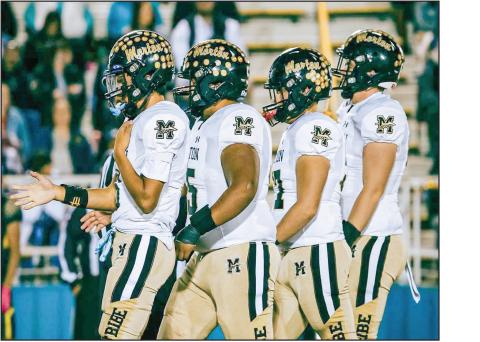 REPPIN’ FOR MORTON - The Morton Indians football players walk together during their game on the road against Hale Center this past Friday. The Indians would fall to Hale Center 55-3. They’ll compete in the first round of the playoffs next week. (Photo provided by Gillian Ruiz)