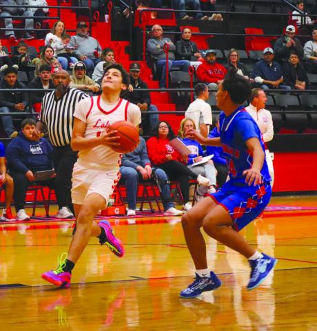 DRIVING IN - Levelland Lobo Ethan Salazar drove into the paint during the team’s game against Sundown before their district opener on the road. (Staff photo by Aalijah Soliz)