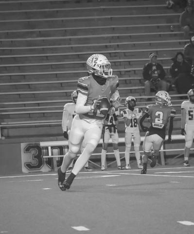THROW ON THE RUN - Ropes Eagle Kade Franklin rolled out of the pocket during the team’s last game against Gruver in Canyon. (Staff photo by Aalijah Soliz)